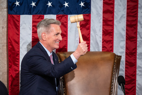 House Speaker Kevin McCarthy (R-Calif.) holds up the Speaker's gavel after winning the House speakership election.