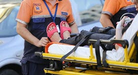Person on ambulance stretcher