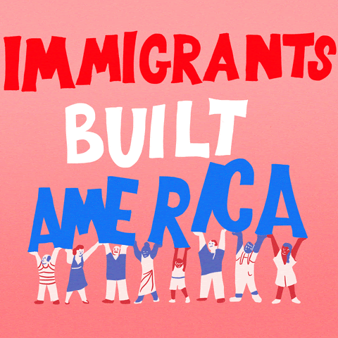 A group of people holding up the phrase "Immigrants built America"