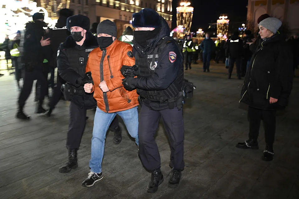 Police officer detain a demonstrator during an action against Russia's attack on Ukraine in Moscow, Russia, Thursday, Feb. 24, 2022. Hundreds of people gathered in the center of Moscow on Thursday, protesting against Russia's attack on Ukraine. Many of the demonstrators were detained. Similar protests took place in other Russian cities, and activists were also arrested. (AP Photo/Dmitry Serebryakov)