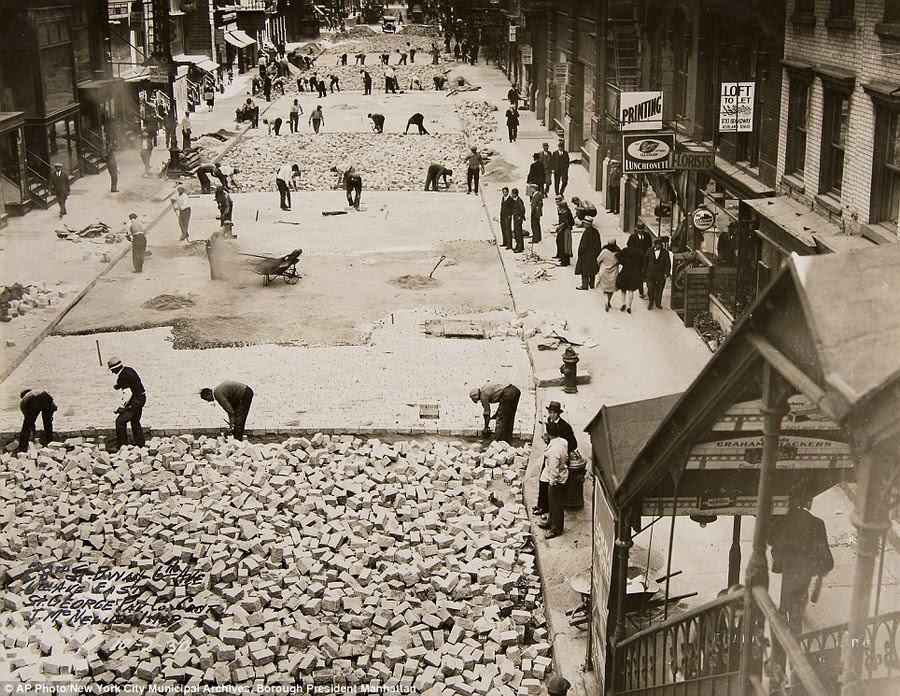 1930                                                          workers pave                                                          28th street                                                          manhattan