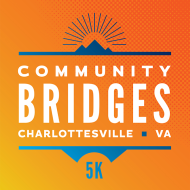 The sun rises from behind blue mountains. White letters read: Community Bridges 5k, Charlottesville, VA