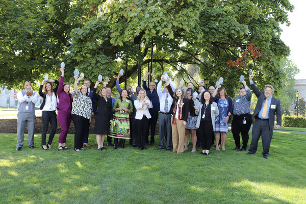 Gov. Jay Inslee celebrates with recipients of the Governor's Leadership Awards