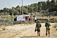 Ambulances evacuate wounded soldiers at the scene where a Palestinian Arab driver rammed his car into Israeli soldiers near Beit Ummar, on November 27, 2015.