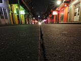 A view of the nearly deserted scene on Bourbon Street, which is normally bustling with tourists and revelers, in the French Quarter of New Orleans, Thursday, March 19, 2020. Louisiana Governor John Bel Edwards and New Orleans Mayor Latoya Cantrell have ordered all restaurants and bars to close except for takeout, and asked residents to remain home and maintain social distancing from others when outside, due to the COVID-19 virus pandemic. (AP Photo/Gerald Herbert)