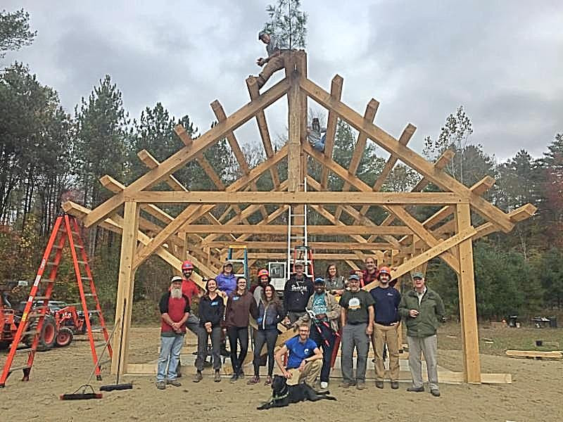 Construction team posing in front of the Pavilion during construction