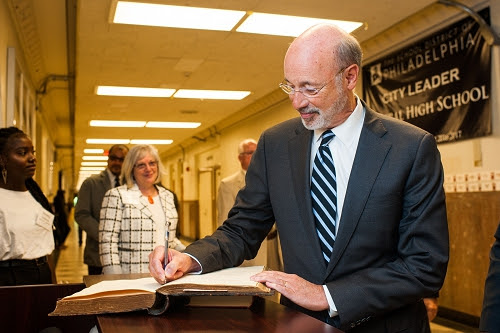 Governor Wolf signing the historic Central High Visitors Book