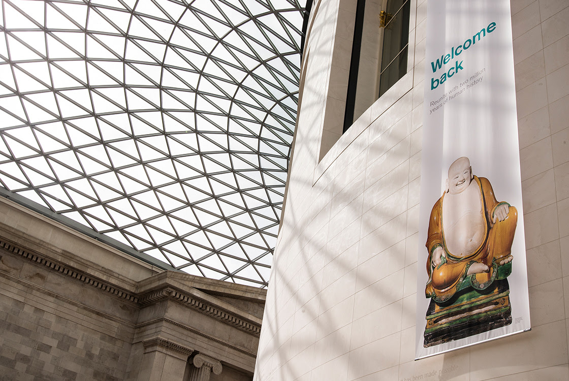 A photograph of the Great Court showing a 'welcome back' banner