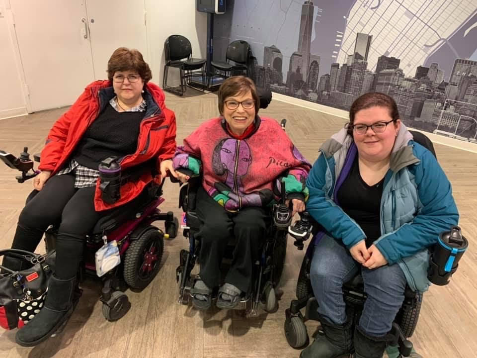 Three women with wheelchairs 