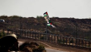 “Palestinian” rioters at Gaza/Israel border throw rocks and firebombs at IDF troops, raise Nazi flag