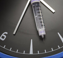 vaccine needle on a clock face