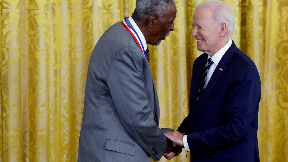 U.S. President Joe Biden shakes hands with Gebisa Ejeta,of Purdue University, after presenting him the National Medal of Science at a ceremony in the East Room of the White House on October 24, 2023 in Washington, DC. Biden held the event to honor the country's top scientists and engineers for their contributions to society.