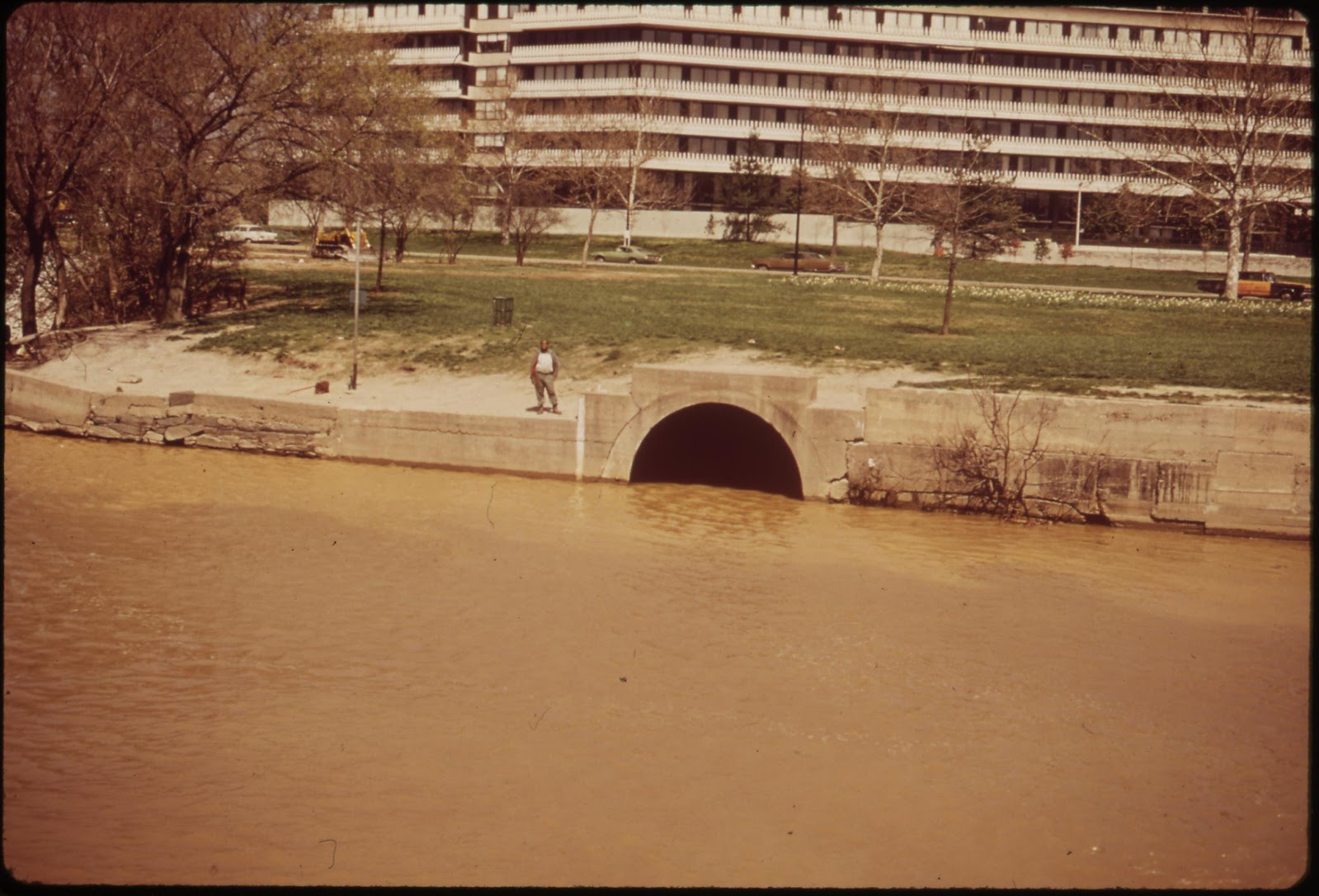 The Georgetown Gap, Through Which Raw Sewage Flows Into The Potomac. Watergate Complex In The Rear, April 1973 | by The U.S. National Archives