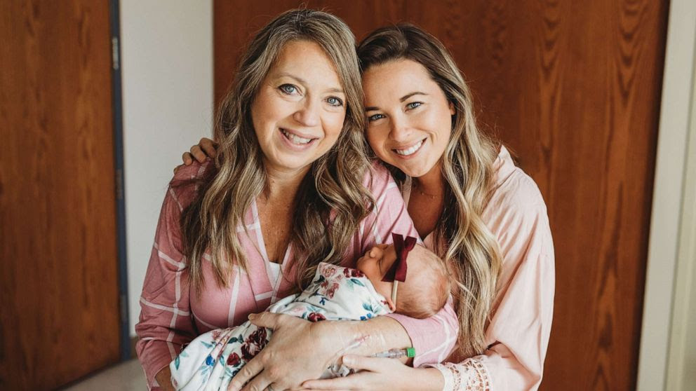 Julie Loving and Breanna Lockwood holding the newborn