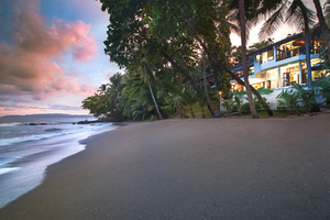 Casa Oceano Beachfront villa at night with sunset
