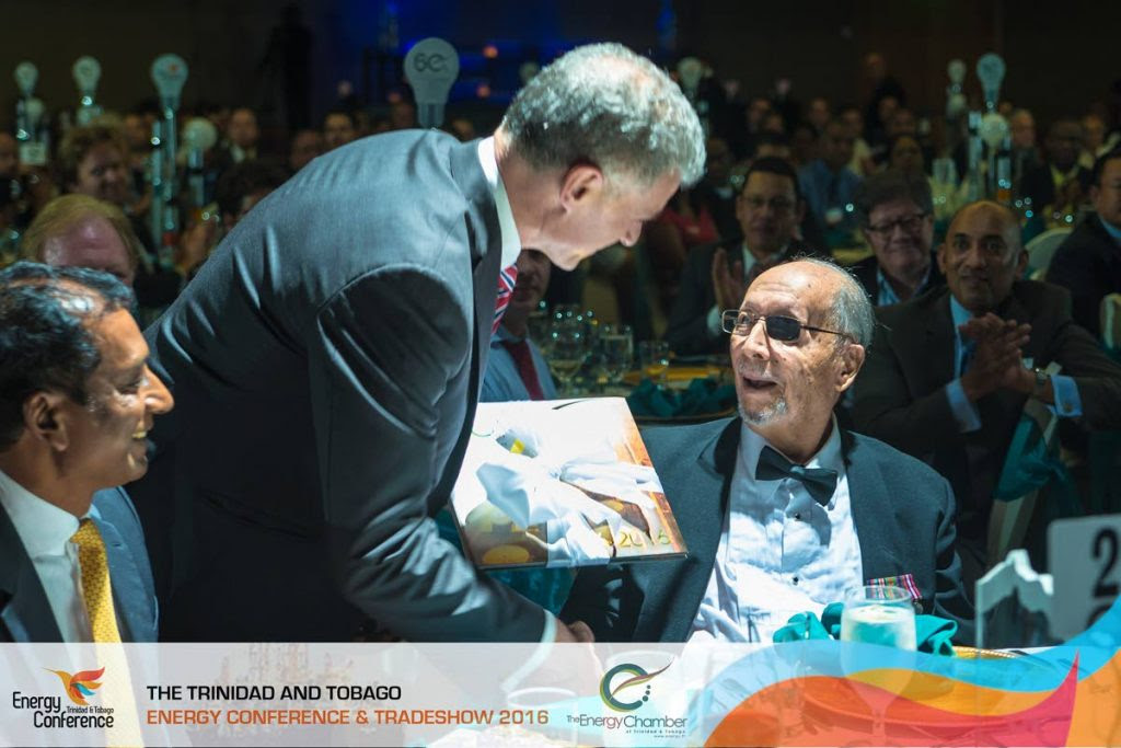 Energy Chamber CEO Energy Chamber CEO Dr Thackwray Driver presents an award to energy visionary Robert Montano during the chamber's energy conference and trade show in 2016. - Media Mill Limited/Energy Chamber