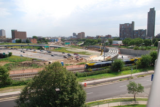 Crews construct a flyover above Interstate 35W to tie the METRO Green Line to the Blue Line in Minneapolis