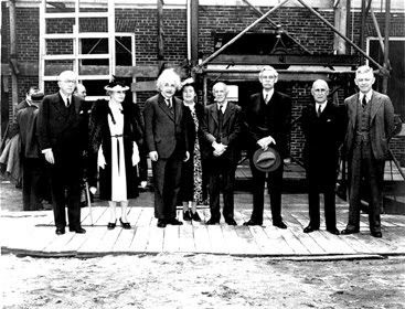 DEDICATING FULD HALL: Albert Einstein takes center stage for this photograph on May 22, 1939 at the dedication ceremony for the Institute for Advanced Study’s new building, Fuld Hall. From left: Alanson B. Houghton, C. Lavinia Bamberger (Louis Bamberger’s sister), Albert Einstein, Mrs. Abraham Flexner (the successful Broadway playwright Anne Crawford), Abraham Flexner, John R. Hardin, Herbert H. Maass, and President of Princeton University Harold W. Dodds.(Image Courtesy of Institute for Advanced Study, Shelby White and Leon Levy Archives Center)