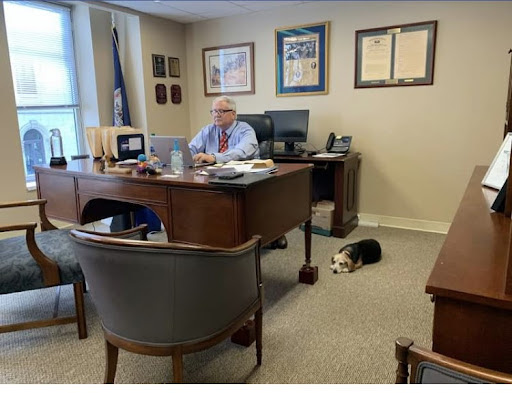 Delegate Buddy Fowler with his beagle, Greta watching over the office.