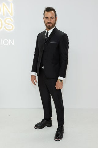 Image may contain Suit Clothing Formal Wear Tuxedo Adult Person Justin Theroux Tie Accessories and Wristwatch