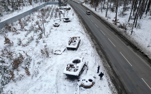 Destroyed Russian tanks covered in snow outside Bucha.