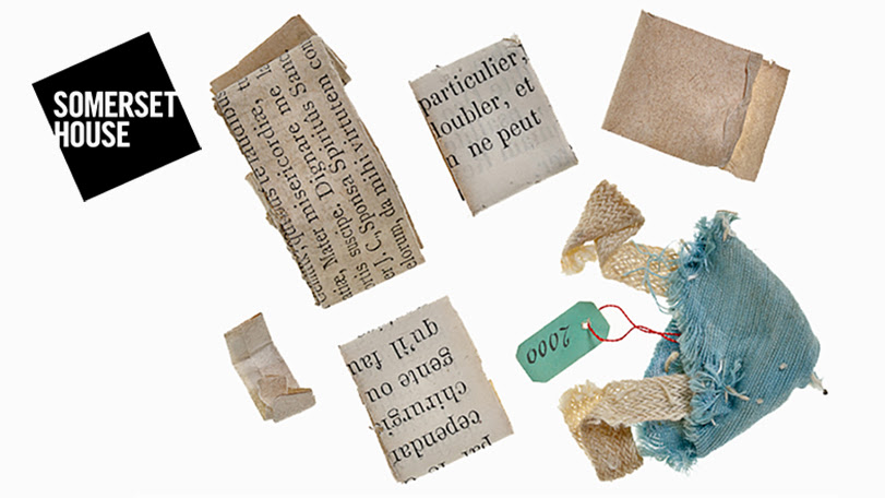 A still from Rebecca Jagoe's embroidery workshop film. It shows scraps of fabric and folded paper with printed text on a white background.