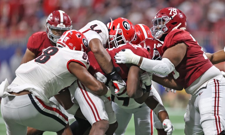 Georgia defense tackles Brian Robinson (#4) of Alabama in SEC Championship