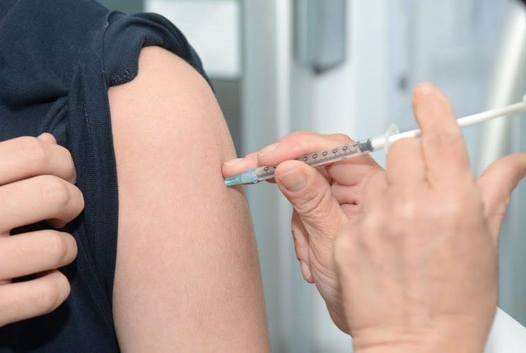 Person injecting flu shot