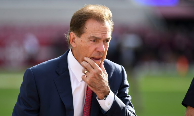 Alabama head coach Nick Saban thinking as he walks across the field at Bryant-Denny Stadium before 2022 game against Mississippi State