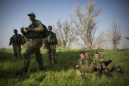 IDF soldiers in a field near Nahal Oz.