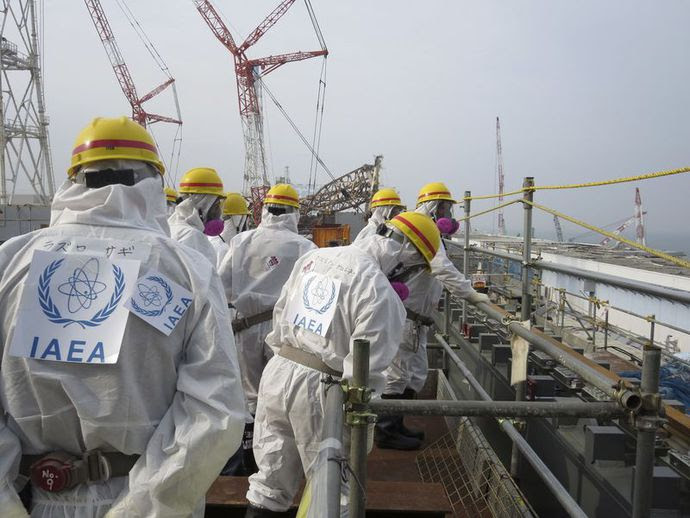 An IAEA team in protective suits is visiting the damaged Fukushima Daiichi nuclear power plant.