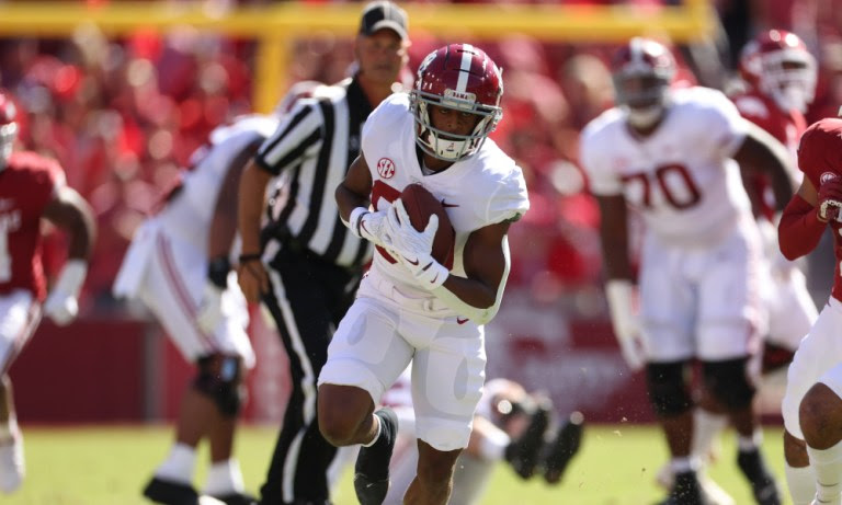 Alabama WR Kobe Prentice (#80) runs the ball versus Arkansas' defense last week