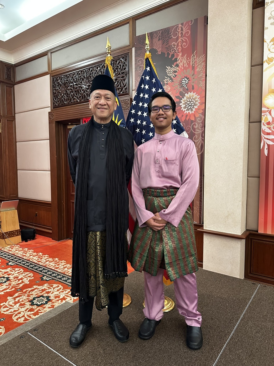 Photograph of Aiman and Ambassador of Malaysia Datuk Seri Nazri Abdul Aziz