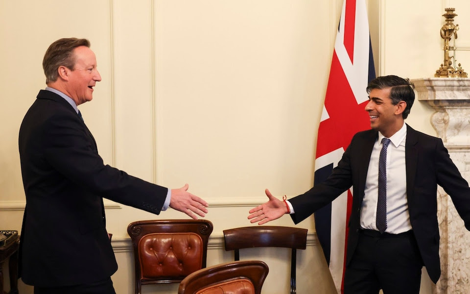 David Cameron shakes hands with the Prime Minister as he is appointed Foreign Secretary