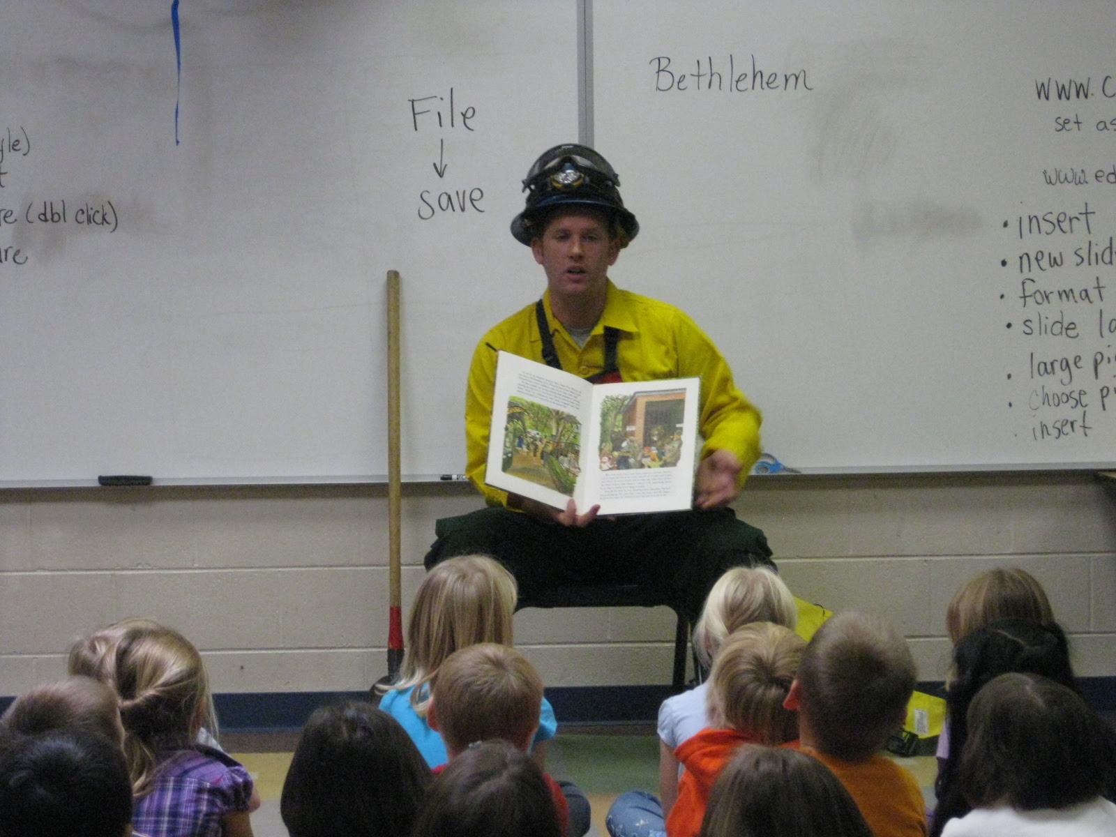 Thomas Black reads the story of Smokey Bear to children