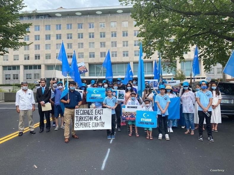 Uyghurs rally outside of the State Department