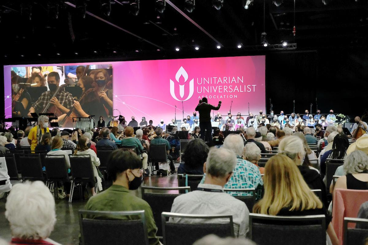 A band plays at UUA General Assembly before a large crowd