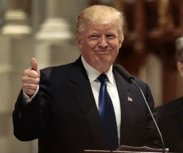 trump smiles and gives thumbs up