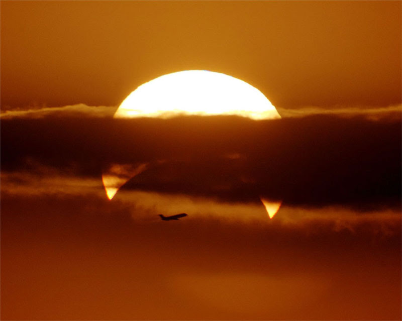 airplaine-crosses-partial-solar-eclipse