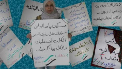 Raqqa activist Suad Nofal with her one-woman demonstration´s banners. Used with permission.