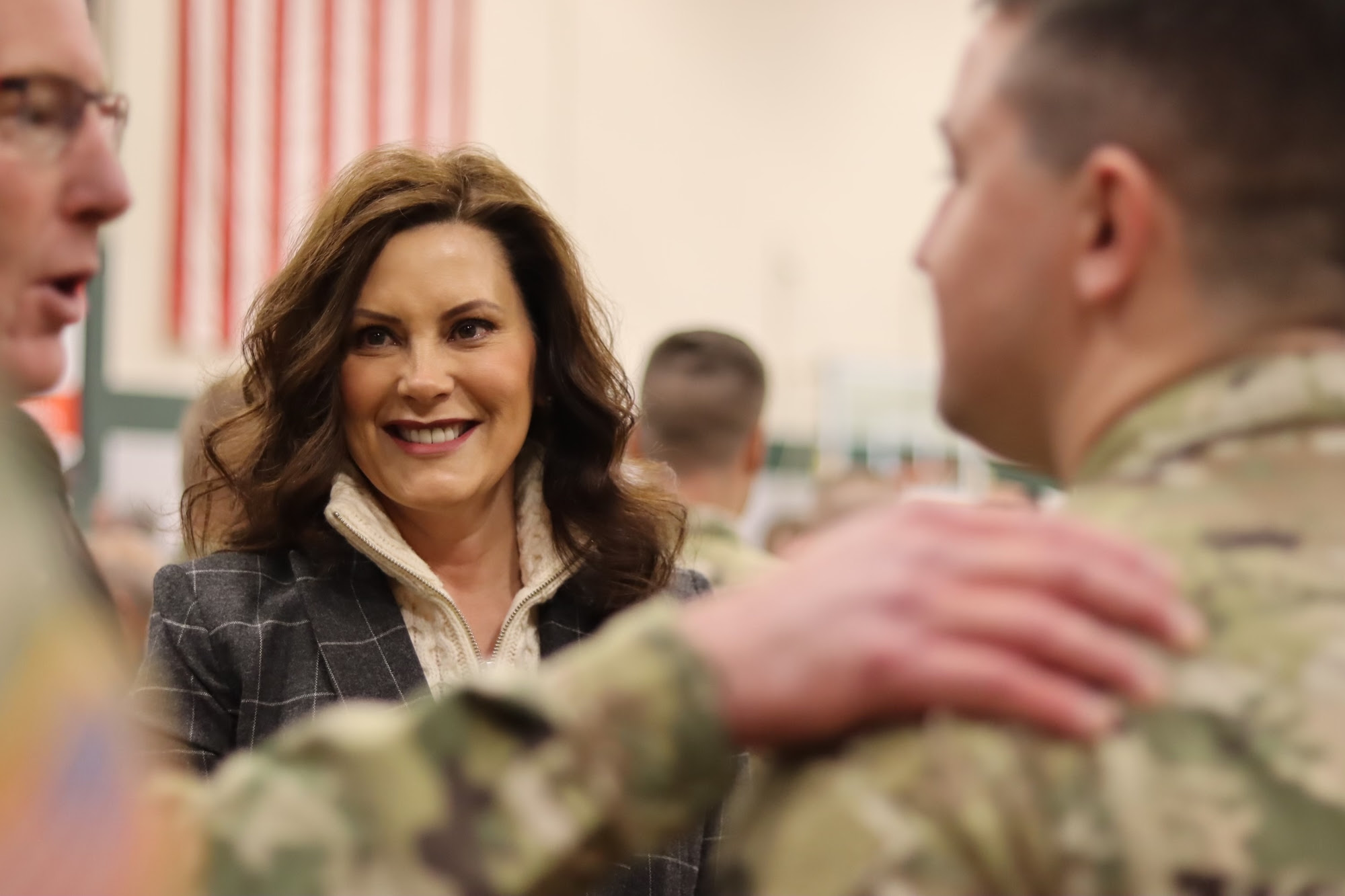Gov. Whitmer speaks with soldiers at the deployment ceremony 