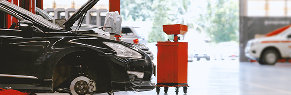 black car getting work done in auto shop