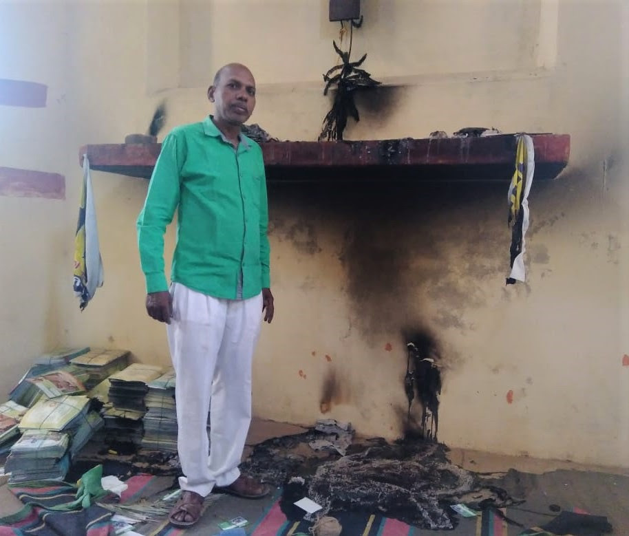  Pastor Anil Juit amid charred debris at church building in Arrah, Bihar state, India. (Morning Star News)
