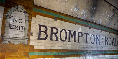 Tiled wall with BROMPTON ROAD - NO EXIT 