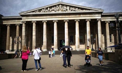 People stand outside the front entrance to the British Museum