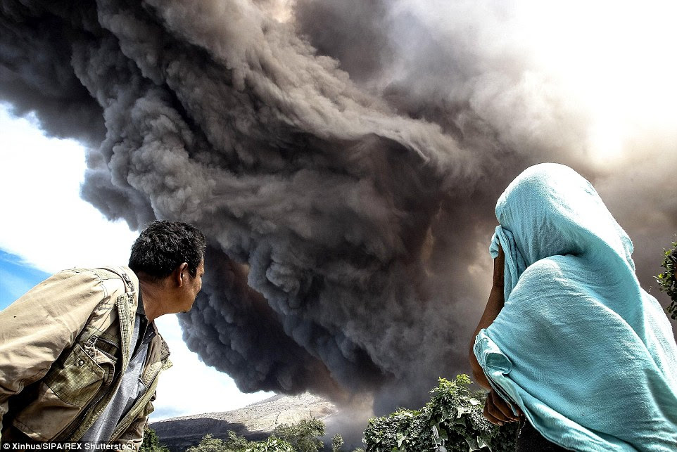 Thousands of villagers flee as Indonesian volcano continues to spew rocks, ash and hot gas  29CB6E0300000578-0-image-a-32_1434796624271