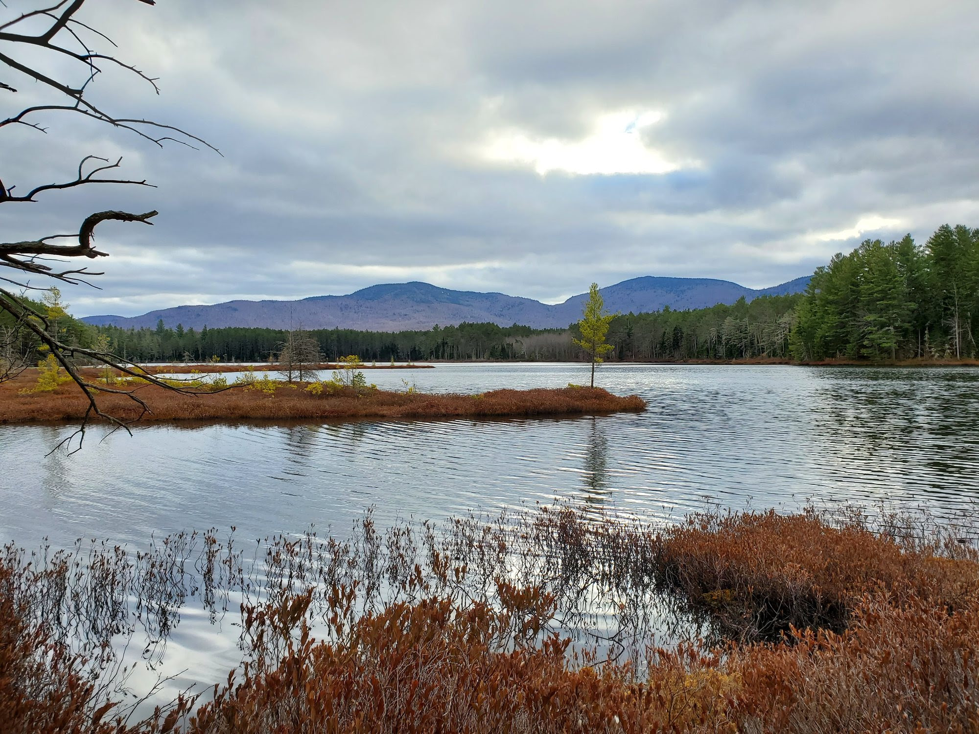 Adirondack pond with mountains in background