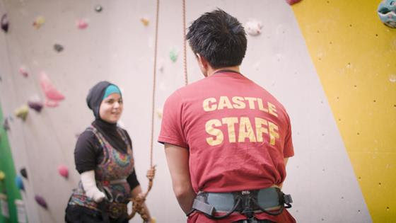 A woman with her climbing instructor