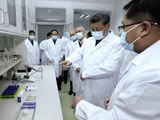 In this photo released by Xinhua News Agency, Chinese President Xi Jinping, second right, wearing a protective face mask, talks to a medical staff members during his visit to the Academy of Military Medical Sciences in Beijing, Monday, March 2, 2020. The number of new virus infections rose worldwide along with fears of a weakening global economy, even as cases in China dropped to their lowest level in six weeks on Monday and hundreds of patients at the outbreak&#39;s epicenter were released from hospitals. (Ju Peng/Xinhua via AP)