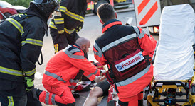 two paramedics providing care to an injuried patient